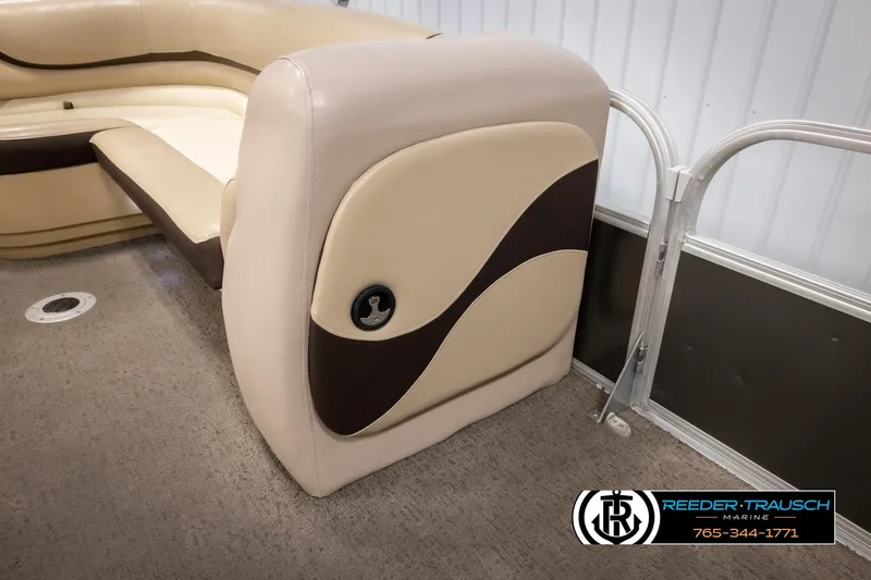 Slide: The Image of 2016 Sun Tracker 24 Party Barge interior with beige and brown seating. - 22
