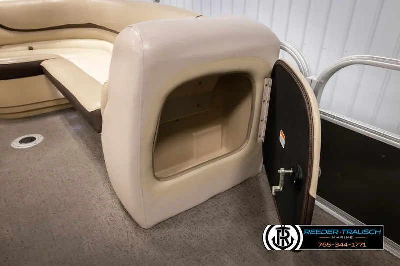 Slide: The Image of 2016 Sun Tracker 24 Party Barge interior storage compartment with open door. - 23