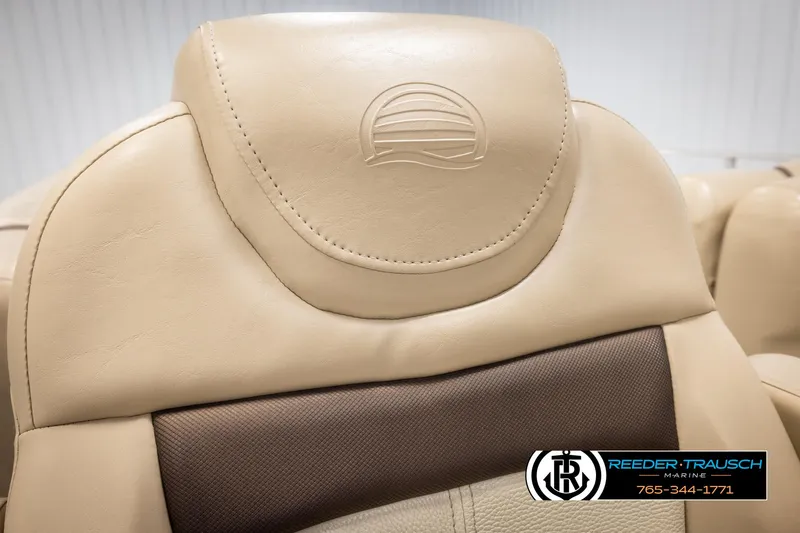 Slide: The Image of Beige leather seat of 2016 Sun Tracker 24 Party Barge with embossed logo. - 34