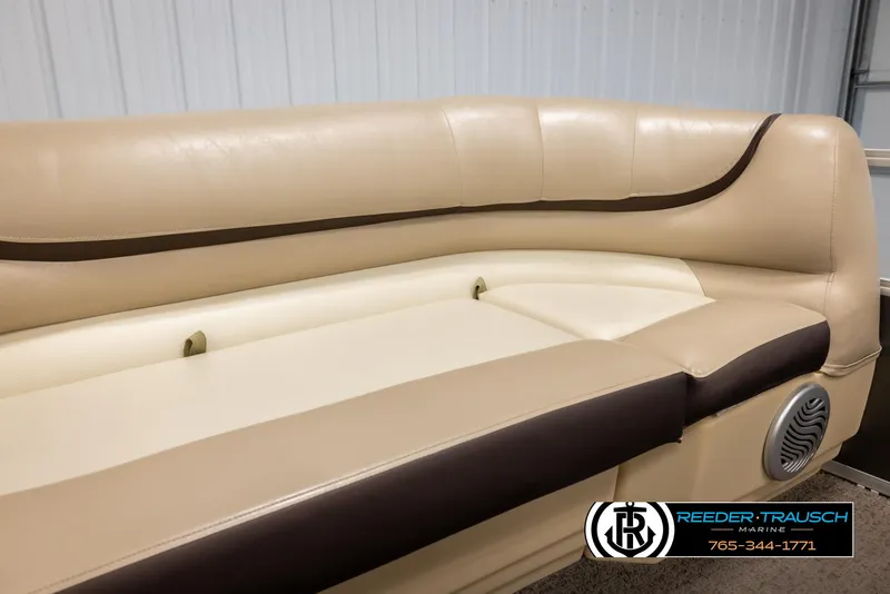 Slide: The Image of 2016 Sun Tracker 24 Party Barge beige and brown seating with speaker detail. - 37