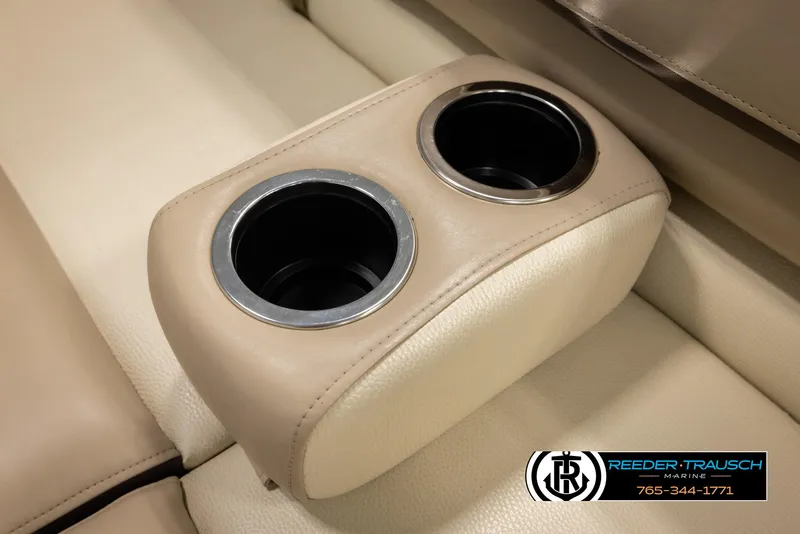 Slide: The Image of Cup holders on 2016 Sun Tracker 24 Party Barge boat, beige leather interior. - 39