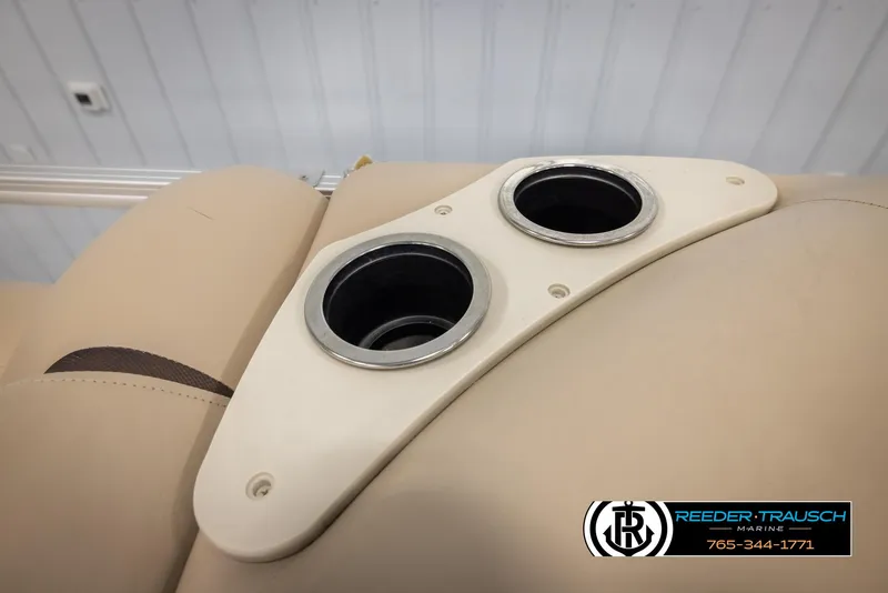Slide: The Image of Cup holders on 2016 Sun Tracker 24 Party Barge boat with beige upholstery. - 40