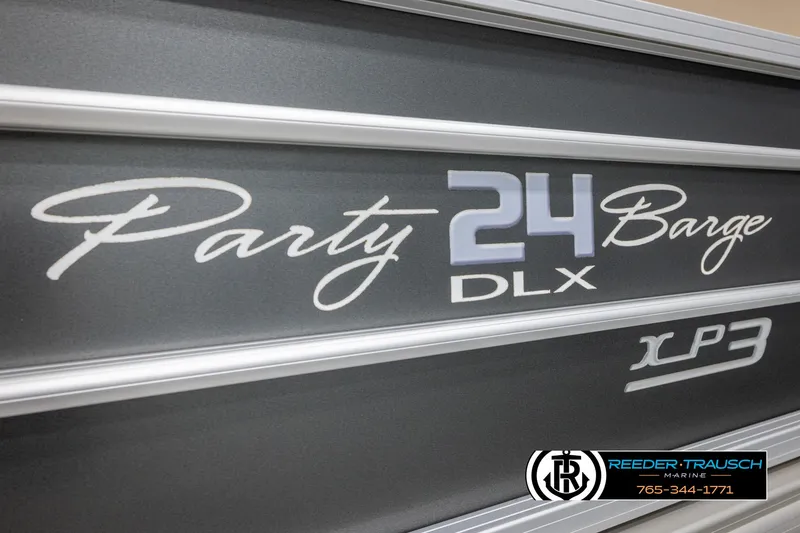 Slide: The Image of 2016 Sun Tracker 24 Party Barge DLX XP3 logo on boat exterior. - 47