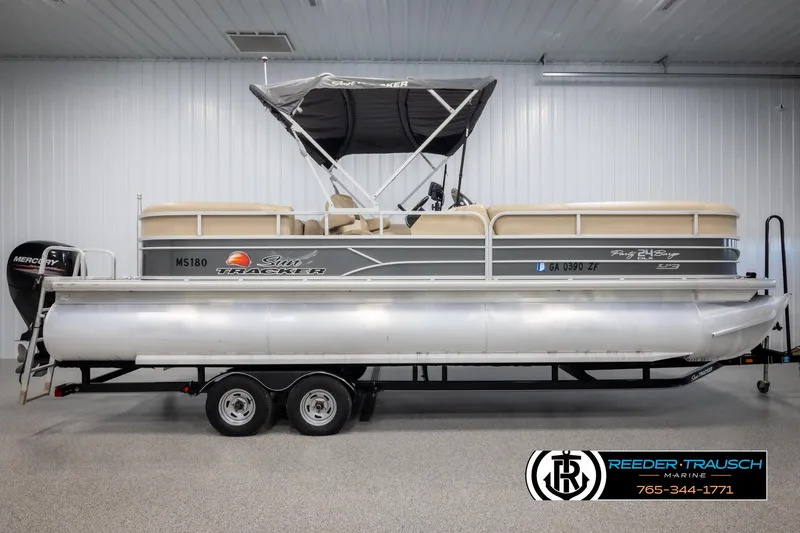 Slide: The Image of 2016 Sun Tracker 24 Party Barge pontoon boat on trailer in indoor showroom. - 5