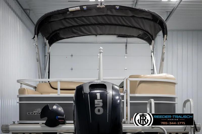 Slide: The Image of 2016 Sun Tracker 24 Party Barge pontoon boat with 150 HP engine in storage. - 7