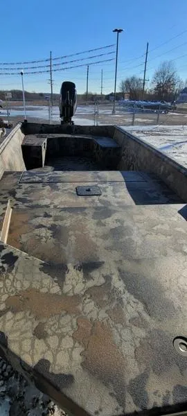 Slide: The Image of 2023 Thor Lake Hammer 1754 Deluxe boat with camouflage interior, parked outdoors on a sunny day. - 3