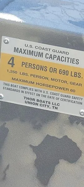 Slide: The Image of 2023 Thor Lake Hammer 1754 boat capacity label: 4 persons or 690 lbs, max horsepower 60. - 4