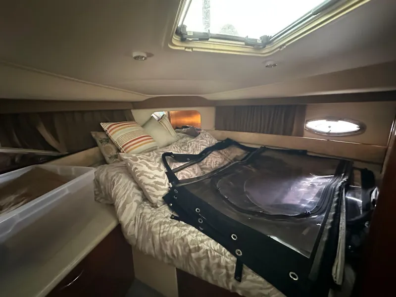 Slide: The Image of Cozy cabin interior of 2003 Carver 356 Motor Yacht with bed and porthole window. - 16