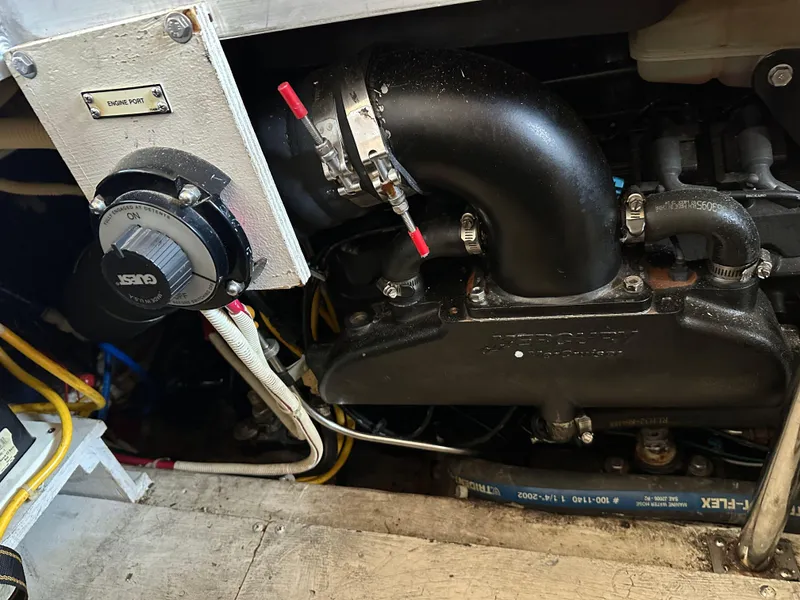 Slide: The Image of Engine compartment of a 2003 Carver 356 Motor Yacht, showing mechanical components and wiring. - 27