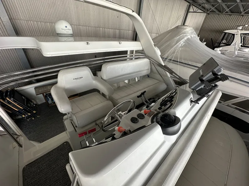 Slide: The Image of 2003 Carver 356 Motor Yacht interior with helm, seating, and navigation equipment. - 29