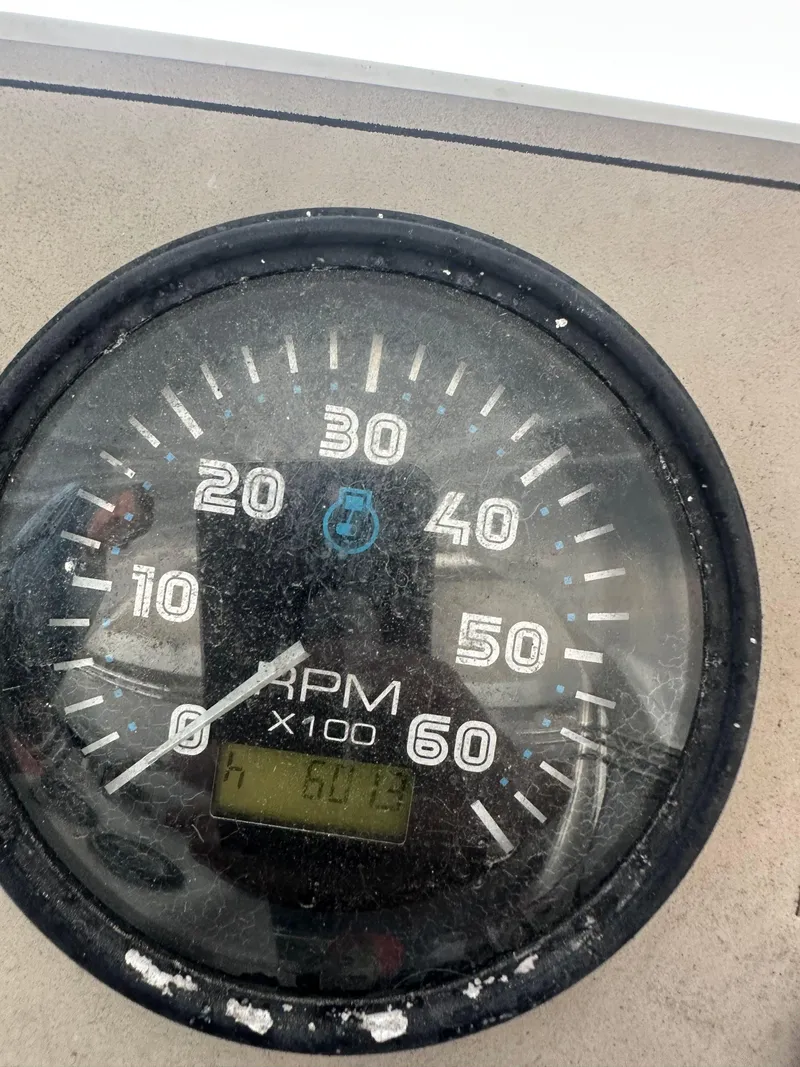 Slide: The Image of Close-up of a 2003 Carver 356 Motor Yacht RPM gauge displaying 601.3 hours. - 31