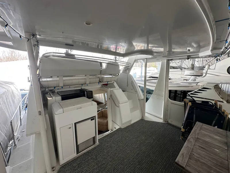 Slide: The Image of 2003 Carver 356 Motor Yacht interior with seating and kitchenette area. - 5