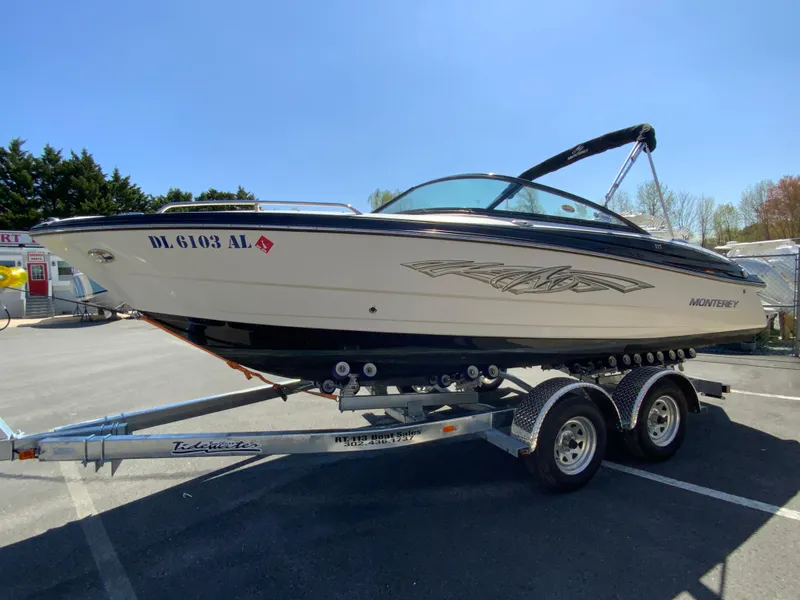 Slide: The Image of 2017 Monterey 217 Outboard boat on trailer in parking lot, side view. - 5