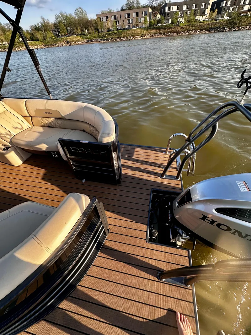 Slide: The Image of 2019 Coach Pontoons 230 RF on water, featuring comfortable seating and Honda motor. - 12