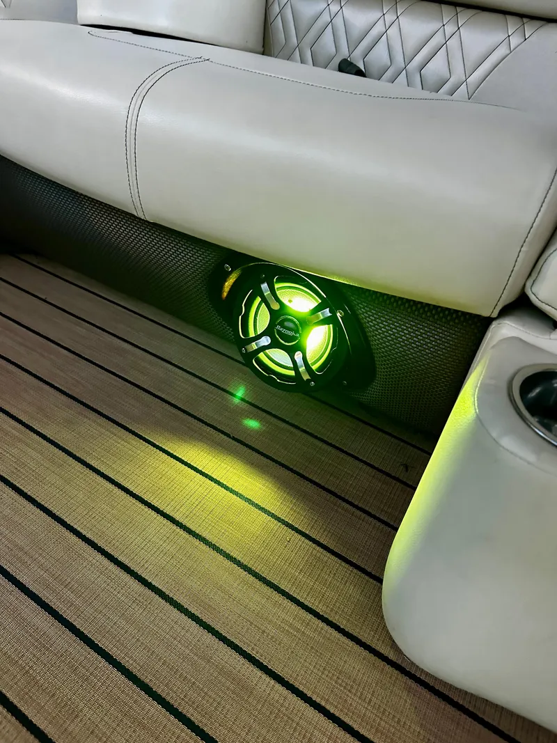 Slide: The Image of 2019 Coach Pontoons 230 RF interior with illuminated speaker and luxurious seating. - 22