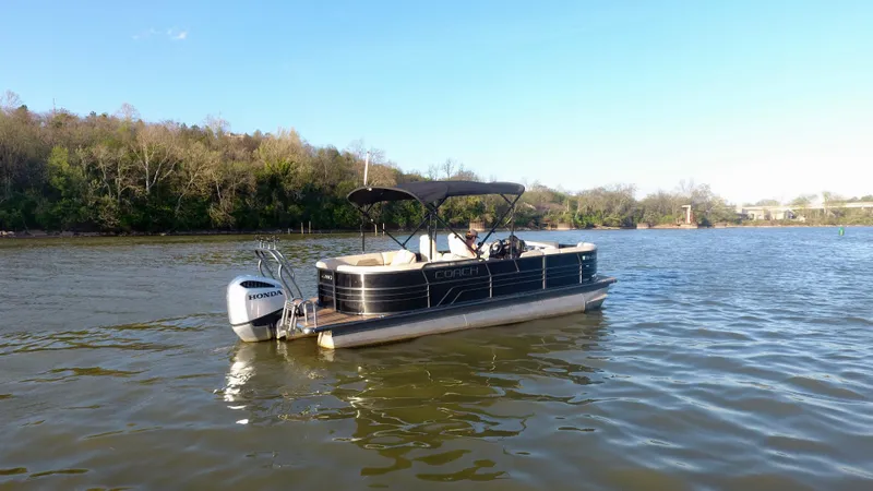 Slide: The Image of 2019 Coach Pontoons 230 RF on a calm lake with scenic background. - 4