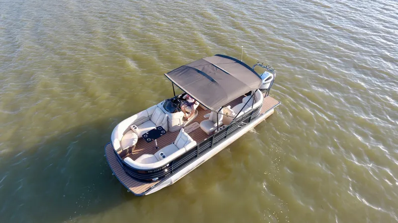 Slide: The Image of 2019 Coach Pontoons 230 RF on calm water, aerial view. - 6