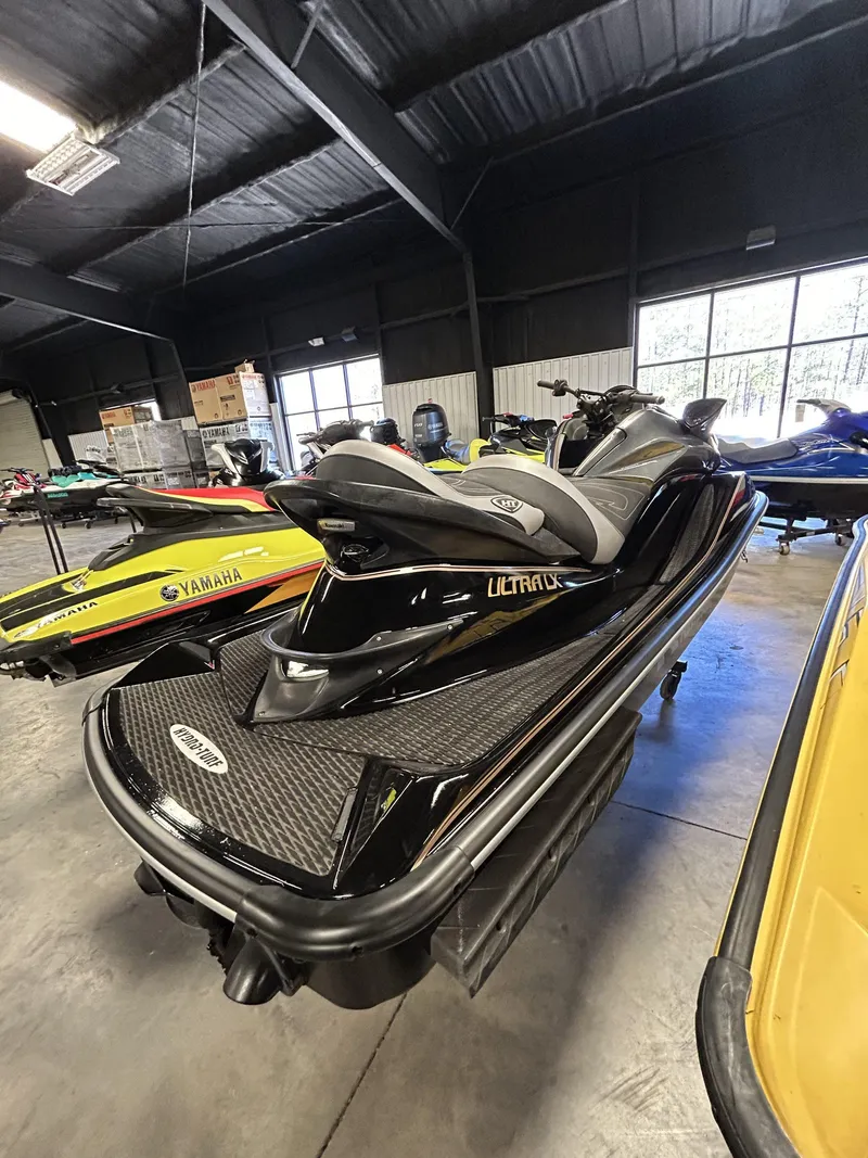 Slide: The Image of 2019 Kawasaki Jet Ski Ultra LX in showroom, black with sleek design. - 3