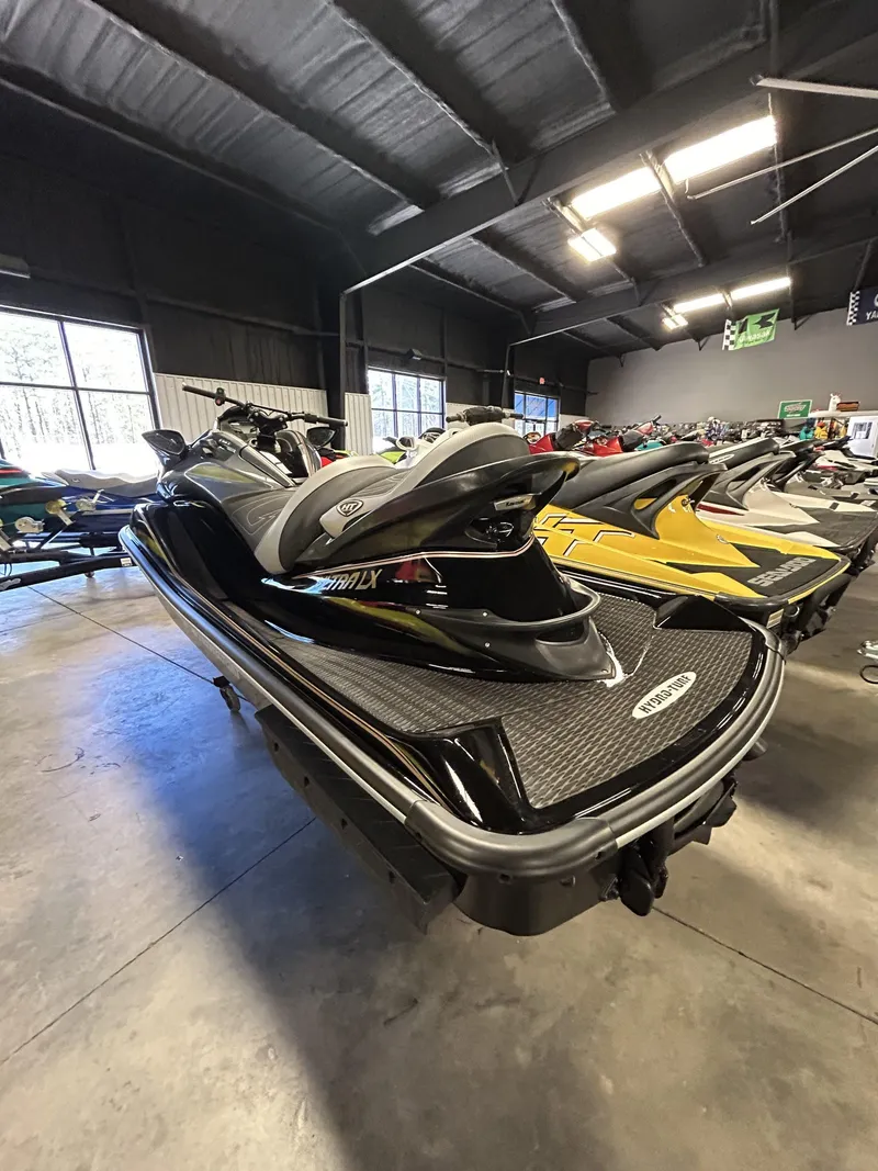 Slide: The Image of 2019 Kawasaki Jet Ski Ultra LX in showroom, black and sleek design. - 4