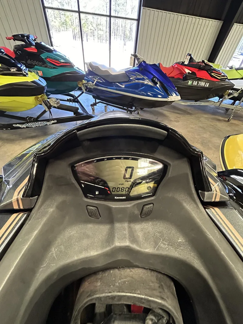 Slide: The Image of 2019 Kawasaki Jet Ski Ultra LX dashboard with digital display, surrounded by various jet skis. - 5