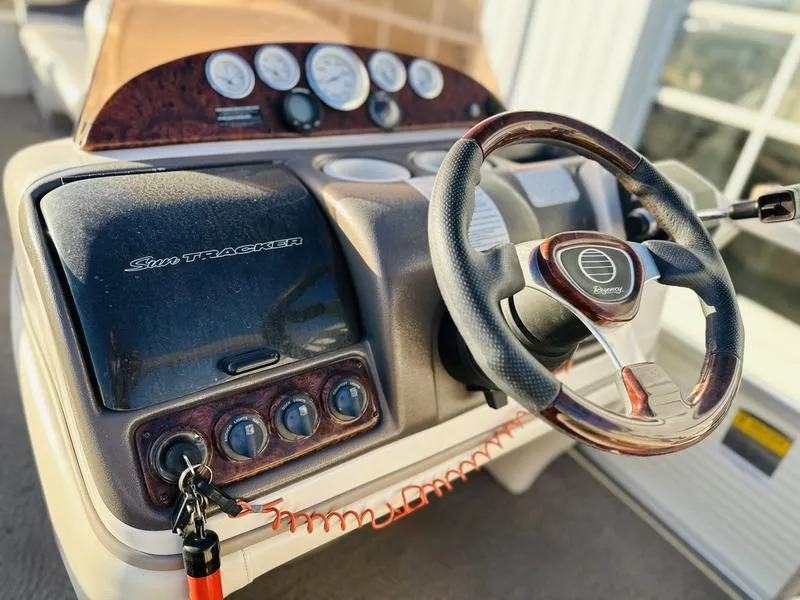 Slide: The Image of 2006 Sun Tracker PARTY BARGE dashboard with steering wheel and control panel. - 11