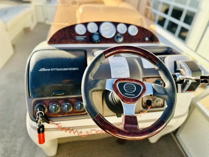 Slide: The Image of 2006 Sun Tracker PARTY BARGE dashboard with steering wheel and control panel. - 12