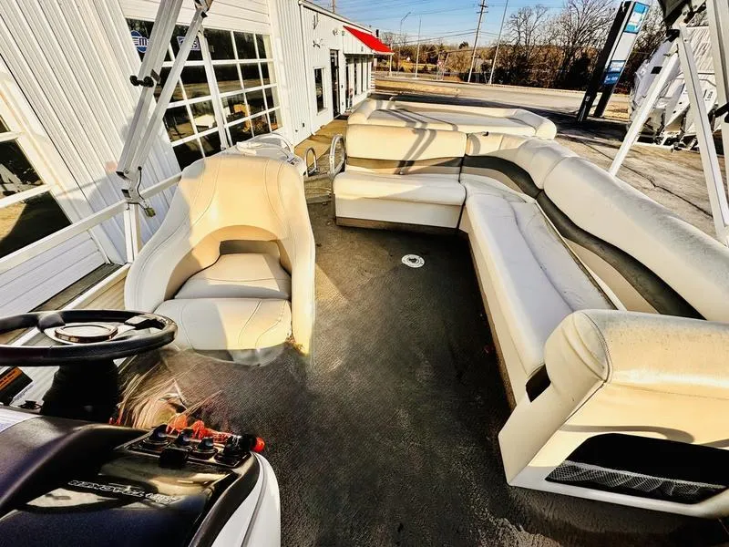 Slide: The Image of 2006 Sun Tracker PARTY BARGE interior with spacious seating and steering console. - 15
