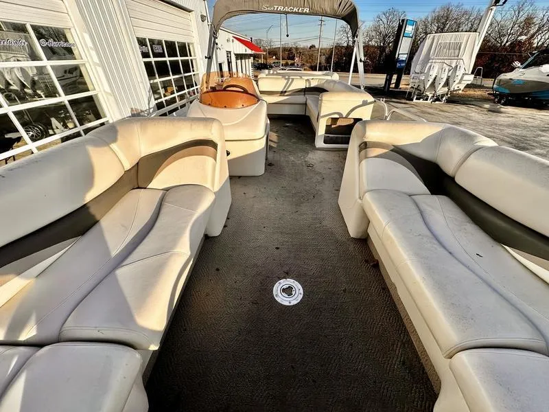 Slide: The Image of 2006 Sun Tracker PARTY BARGE interior with spacious seating and steering console. - 19