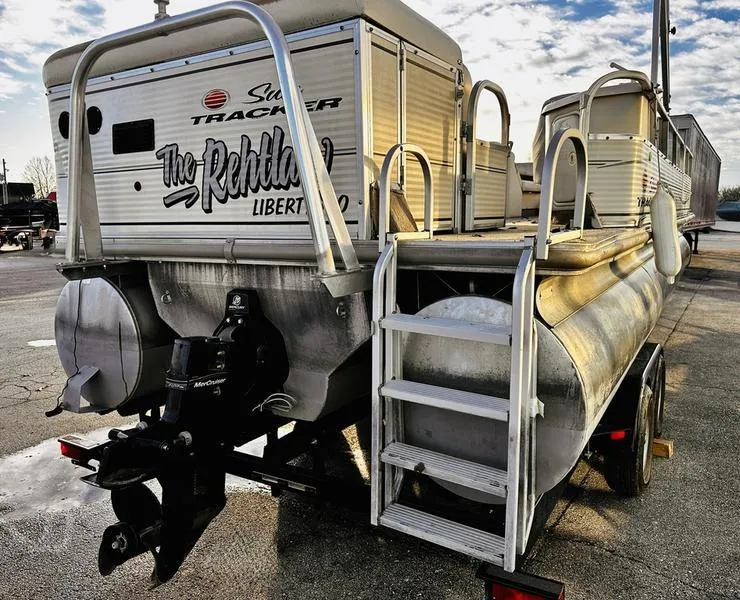 Slide: The Image of 2006 Sun Tracker PARTY BARGE pontoon boat on trailer, rear view with ladder and motor. - 24