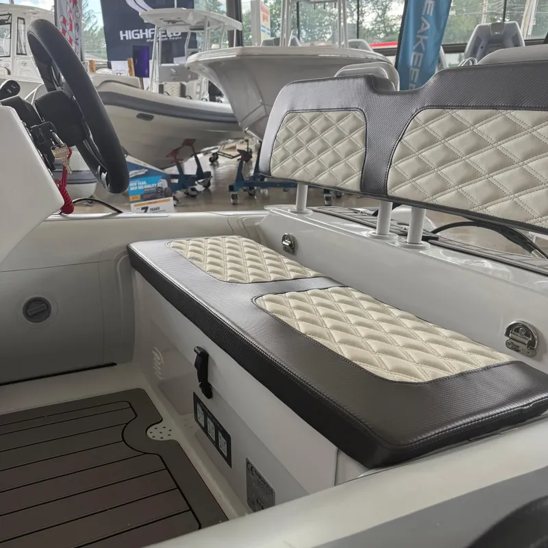 Slide: The Image of Interior of 2025 Highfield Sport 390 boat with cushioned seating and sleek design. - 10