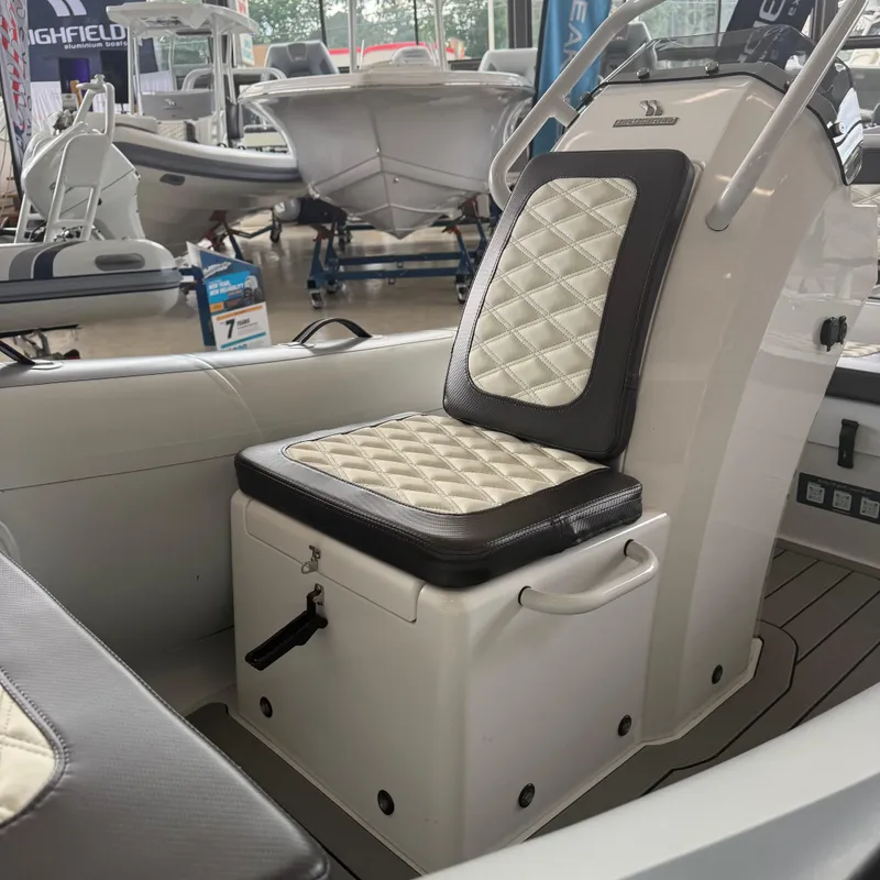 Slide: The Image of 2025 Highfield Sport 390 boat interior with quilted seating and sleek design. - 12