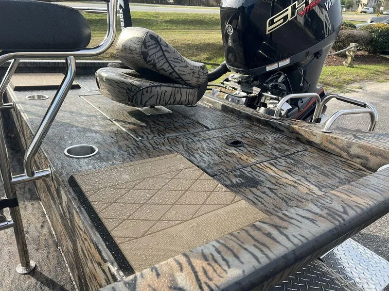 Slide: The Image of 2025 Xpress H210 BAY boat with camo design and Yamaha engine. - 5