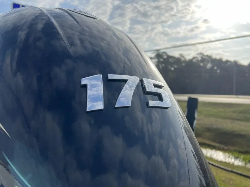 Slide: The Image of Close-up of 175 horsepower engine on 2025 Xpress H210 BAY boat under cloudy sky. - 6