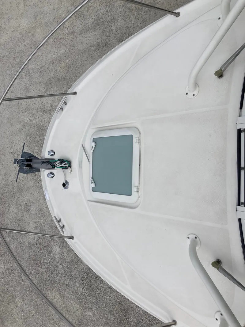 Slide: The Image of 2014 Wellcraft 232 Coastal boat deck with anchor and hatch. - 13