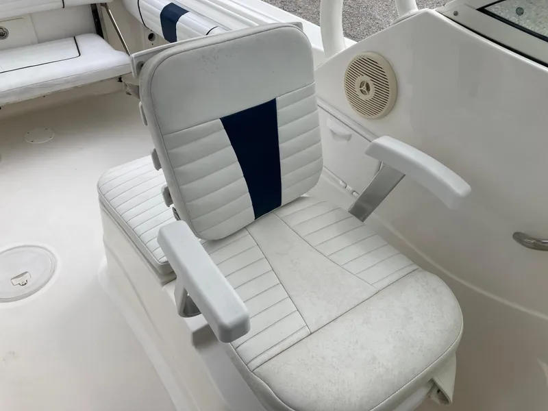Slide: The Image of 2014 Wellcraft 232 Coastal boat seat with white and blue upholstery. - 18