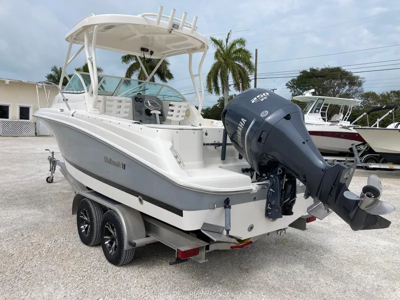Slide: The Image of 2014 Wellcraft 232 Coastal boat with Yamaha outboard motor on a trailer. - 4