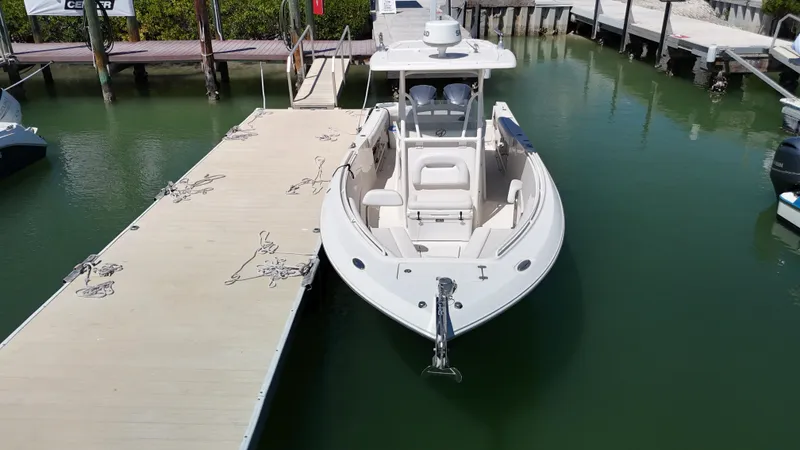 Slide: The Image of 2015 Sailfish 290cc boat docked at a marina, viewed from above. - 5