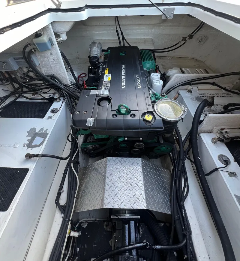 Slide: The Image of Engine compartment of a 2010 Centurion Parasail Boat, featuring a Volvo Penta engine. - 5