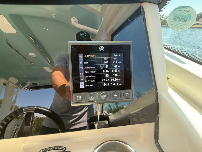 Slide: The Image of Dashboard display on a 2023 Boston Whaler 280 Vantage boat, showing engine metrics. - 22
