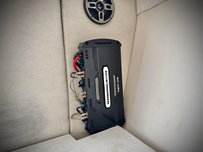 Slide: The Image of 2002 Baja 24H2X boat interior with audio amplifier and speaker setup. - 20