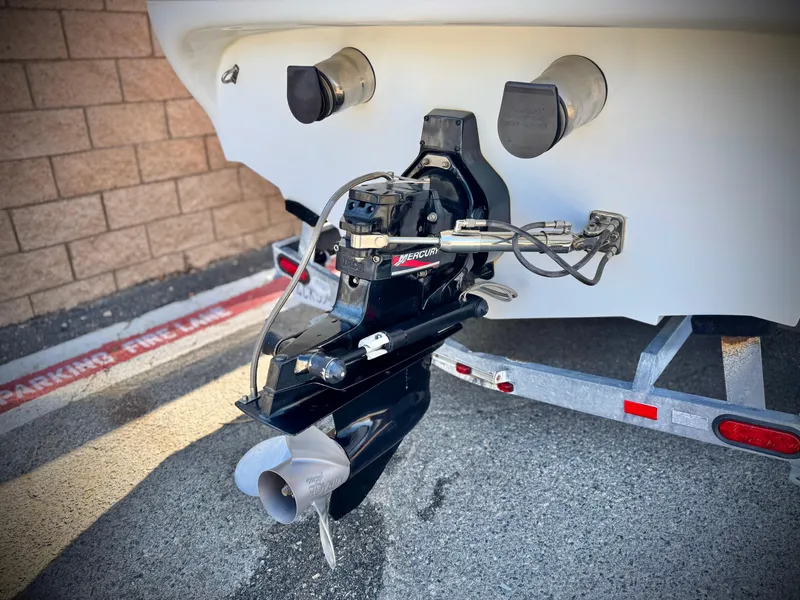 Slide: The Image of Rear view of a 2002 Baja 24H2X boat with a Mercury outboard motor. - 7