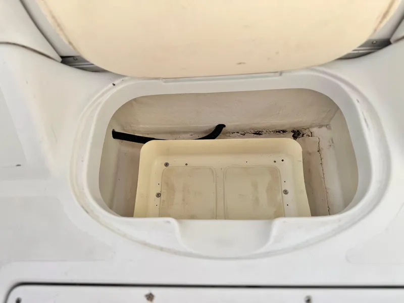 Slide: The Image of Open storage compartment in a 2002 Baja 24H2X boat. - 21