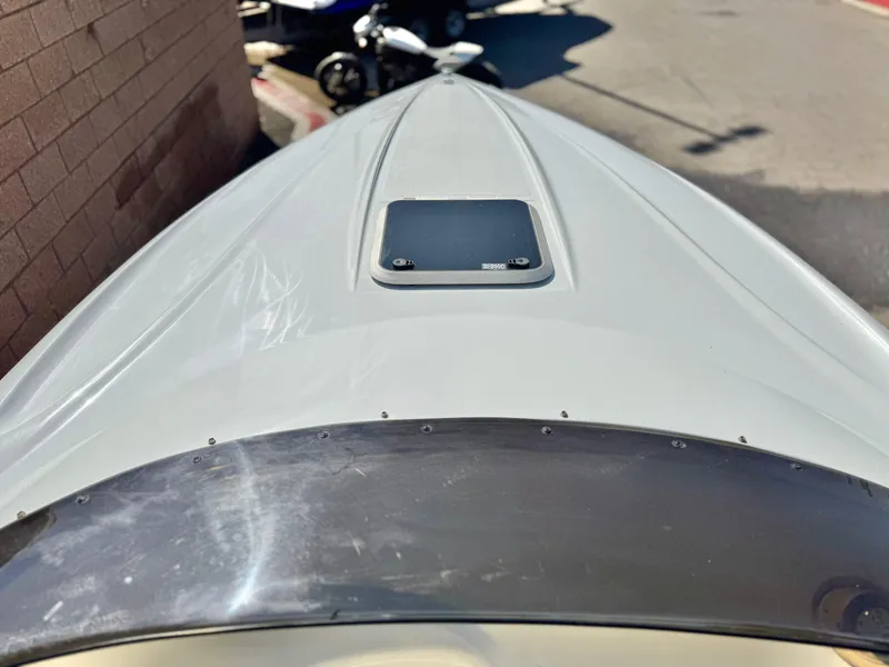 Slide: The Image of 2002 Baja 24H2X boat bow, white finish, parked outdoors. - 9