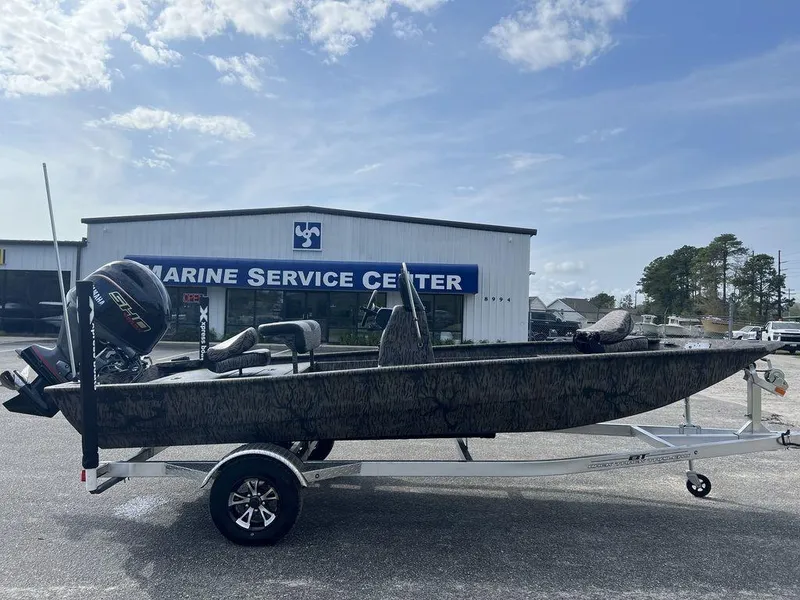 Slide: The Image of 2025 Xpress XP18CC boat on trailer at Marine Service Center. - 3