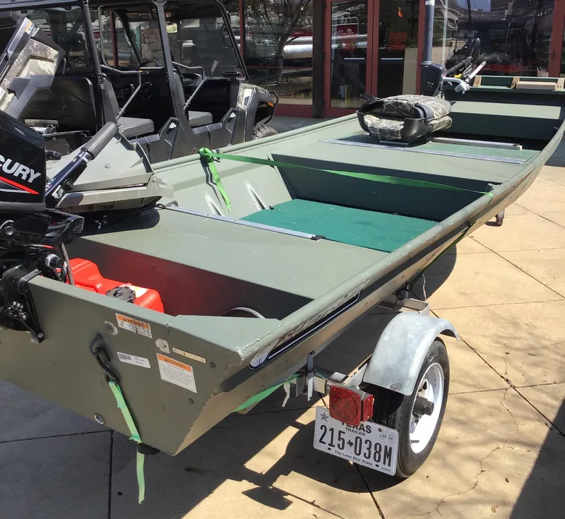 Slide: The Image of 2021 Gamefisherman 14 boat on trailer, featuring Mercury outboard motor. - 3