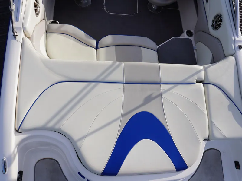Slide: The Image of Luxurious seating in a 2013 Bryant 220 boat with white and blue upholstery. - 10
