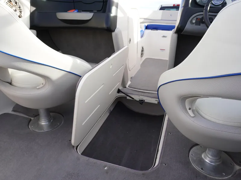 Slide: The Image of Interior of a 2013 Bryant 220 boat showing seating and storage compartment. - 24