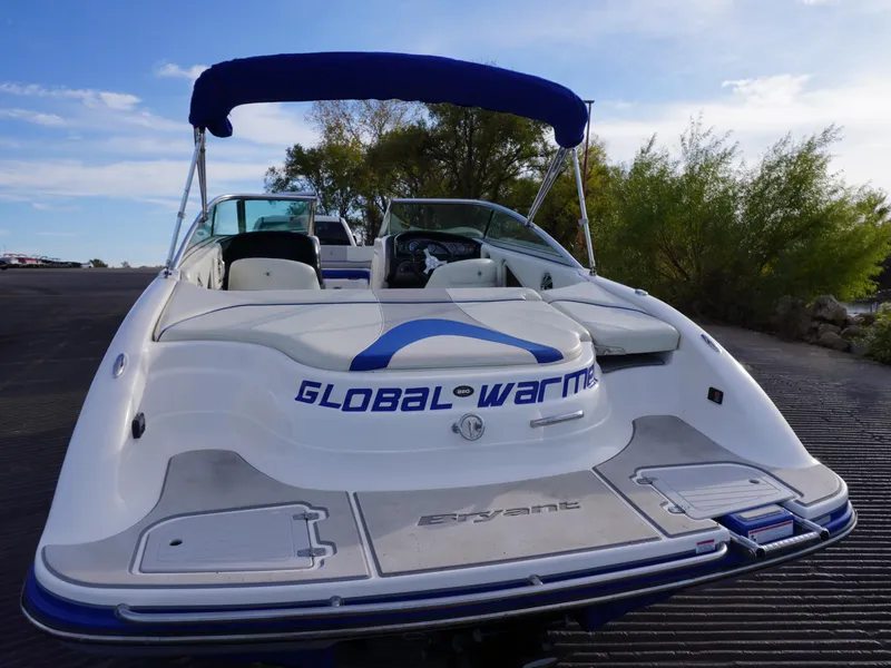 Slide: The Image of Bryant 220 boat, 2013 model, with "Global Warmer" text, docked under a blue sky. - 9