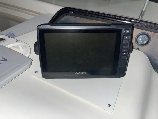 Slide: The Image of Garmin navigation system on 1996 Sea Ray 290 Sundancer boat dashboard. - 11