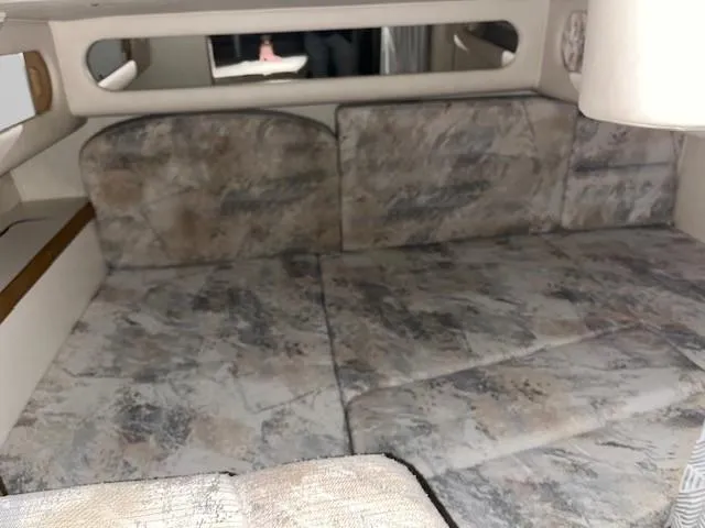 Slide: The Image of Interior cabin of 1996 Sea Ray 290 Sundancer with patterned upholstery. - 17